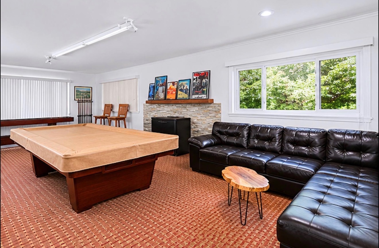 Game room with pool table and sectional sofa